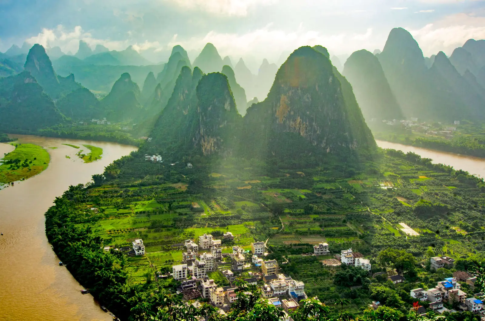 Towering karst limestone peaks above a bend in the Li River and the Yangshuo countryside in Guangxi