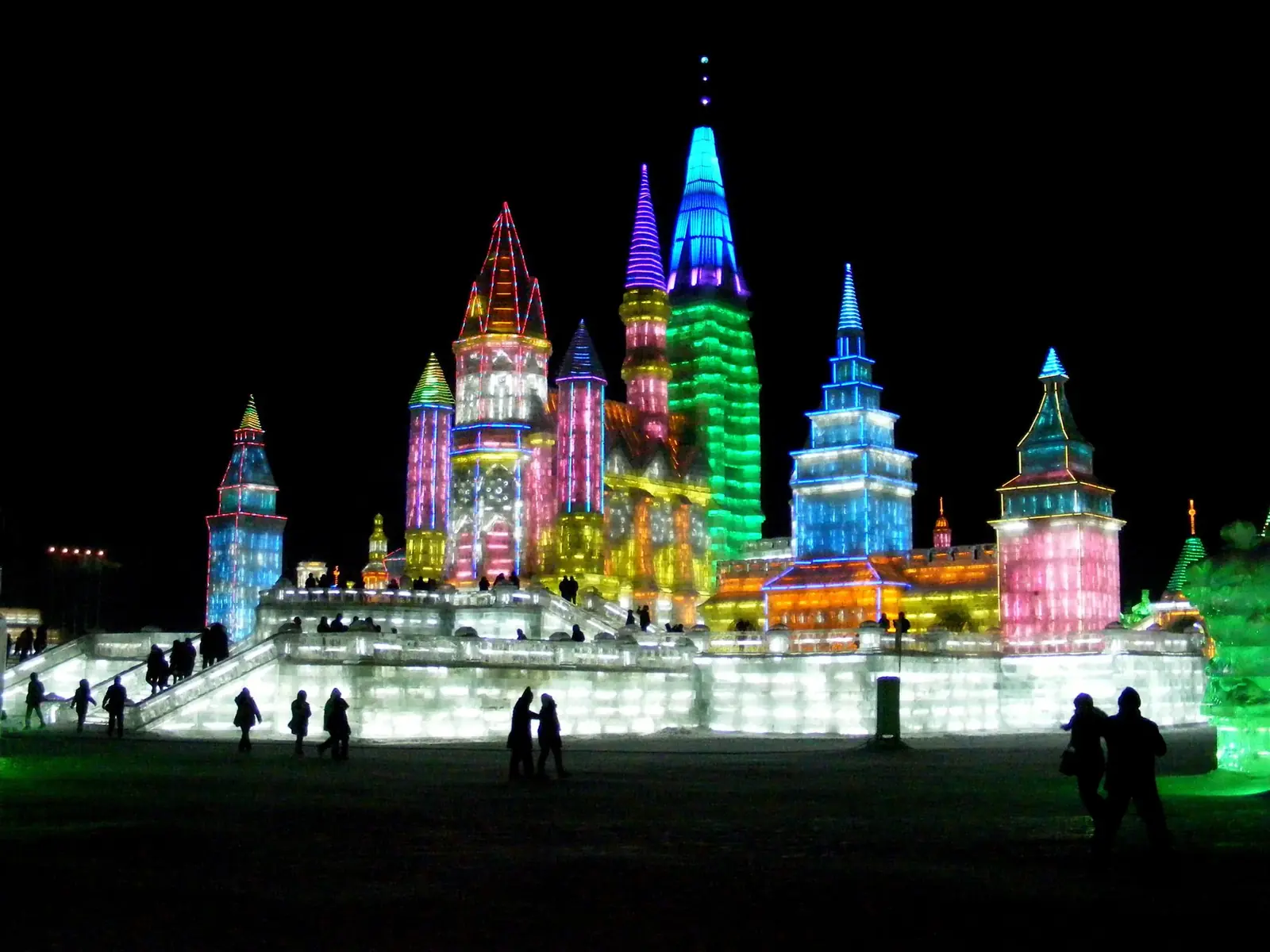 Illuminated ice sculptures at night at Harbin's Ice and Snow World