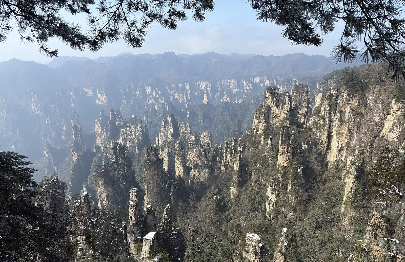 Stone pillars rising through mist in Zhangjiajie National Forest Park